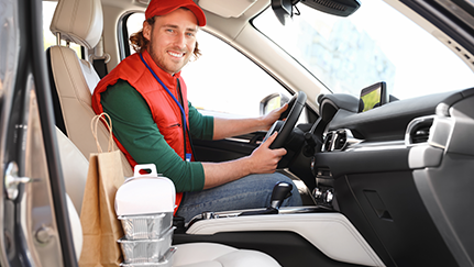 man sitting in the drivers seat of a commercial vehicle