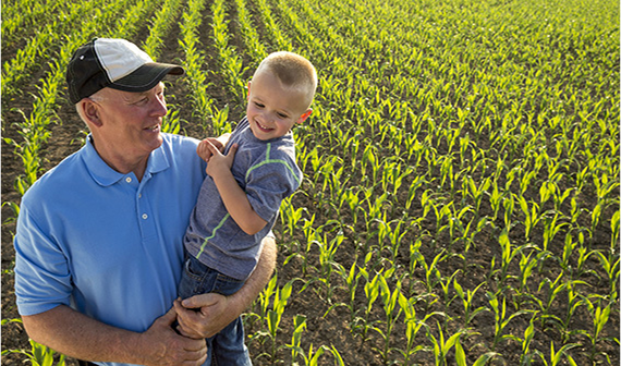 farmer and child in field