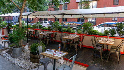 diners eating at an outdoor table