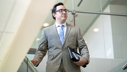 Business woman walking through commercial office space