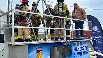 Firefighters on manure pit rescue simulator