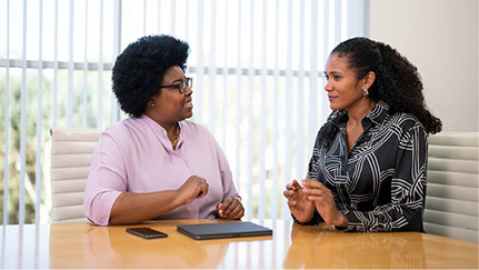 Employees discussing their goals