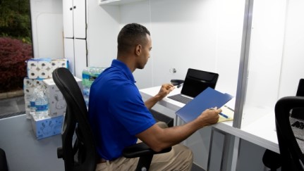 man working on a tablet in an office
