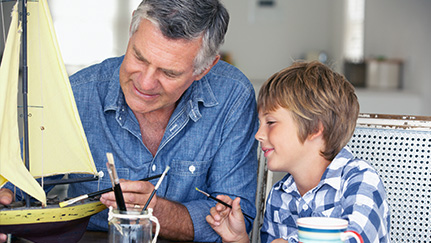 a father and his son sailing on a boat