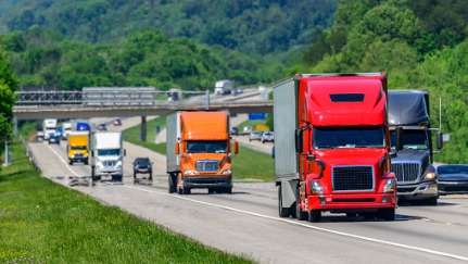 semi trucks driving on the highway