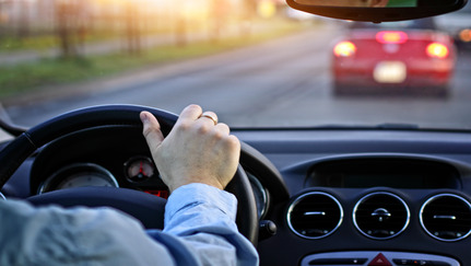 Man driving a car in traffic