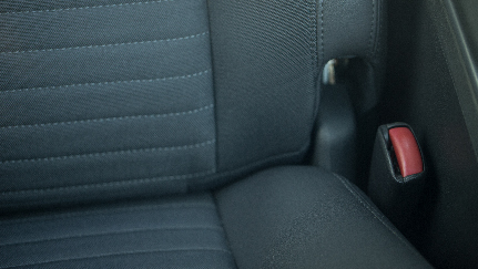 close-up of a car's seat and seat belt