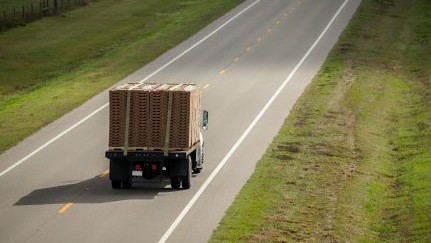 Semi-truck and trailer on rural road