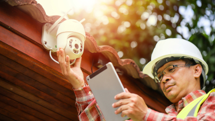 Person installing home security camera