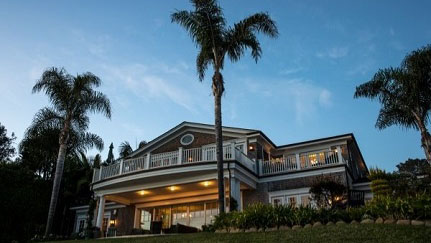 Exterior of home with trees in yard