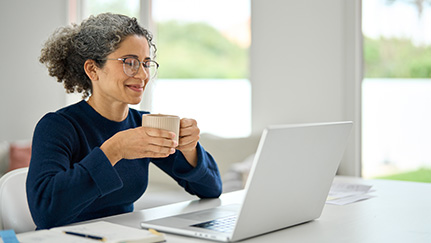 woman reading from laptop