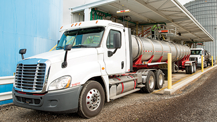 Commercial truck getting fuel