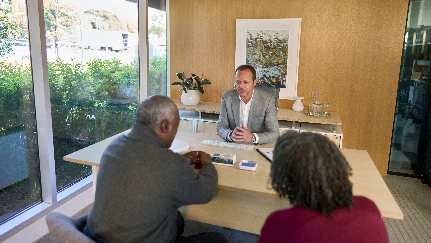 couple meeting with a financial advisor in his office