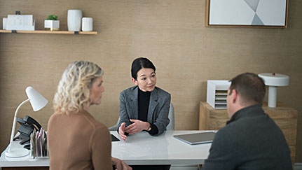 group of people around a table in an office