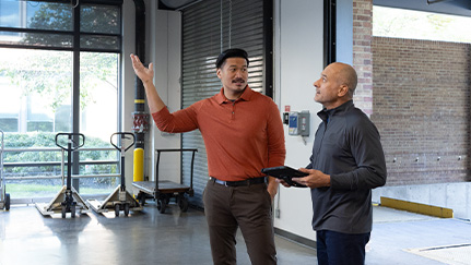 man and Nationwide employee discussing paperwork