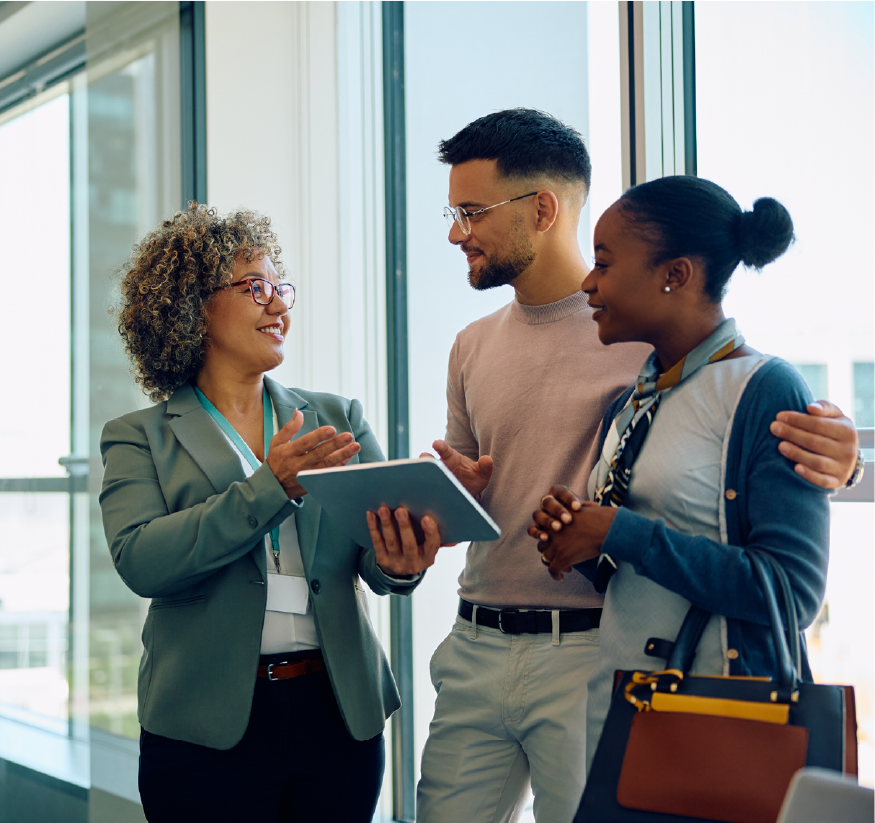 Gen z couple talking with a financial professional and looking at a tablet