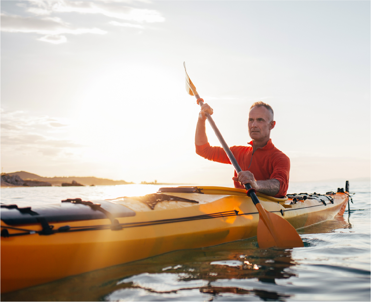 man in a canoe with the sun shining