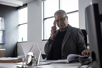 male employee sitting at meeting table