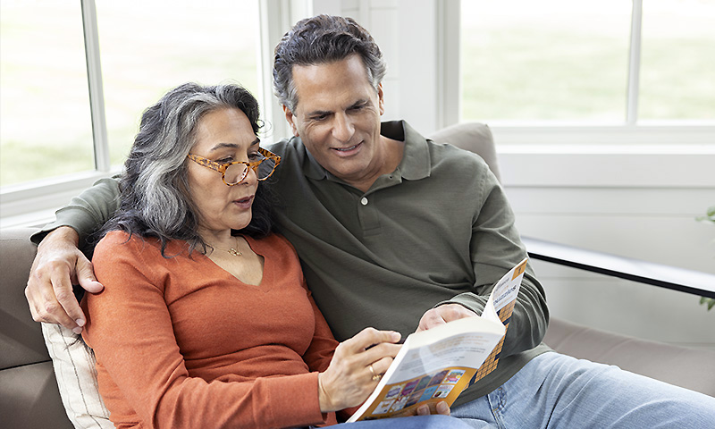 Older man and woman, sitting together on a porch